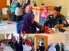 Yonif TP 915/Bitu’o Gelar Posyandu dan Pengobatan Gratis bagi Warga Desa Piloliyanga